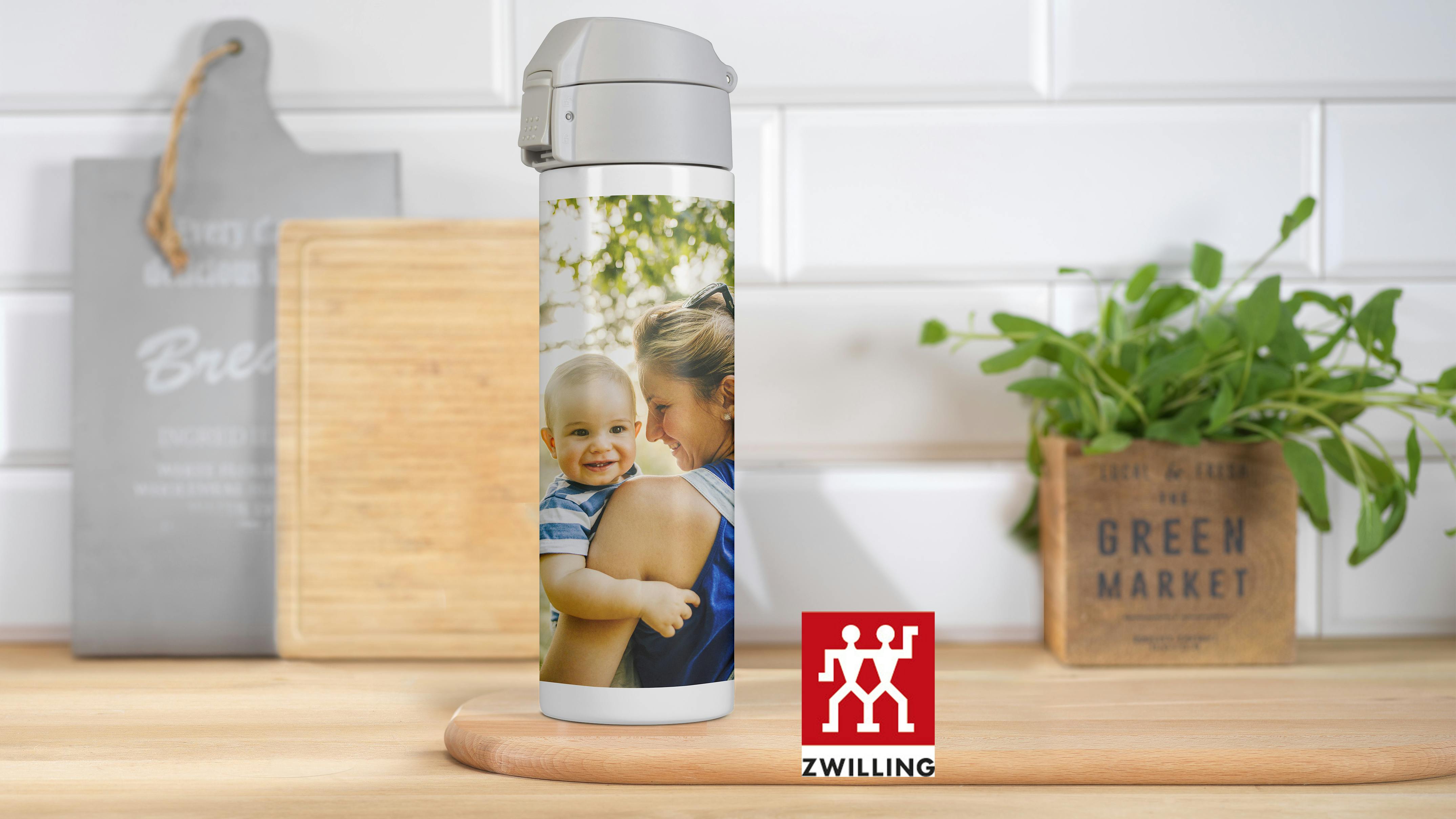 ZWILLING thermo mug with photo in a kitchen setting with a family photo
