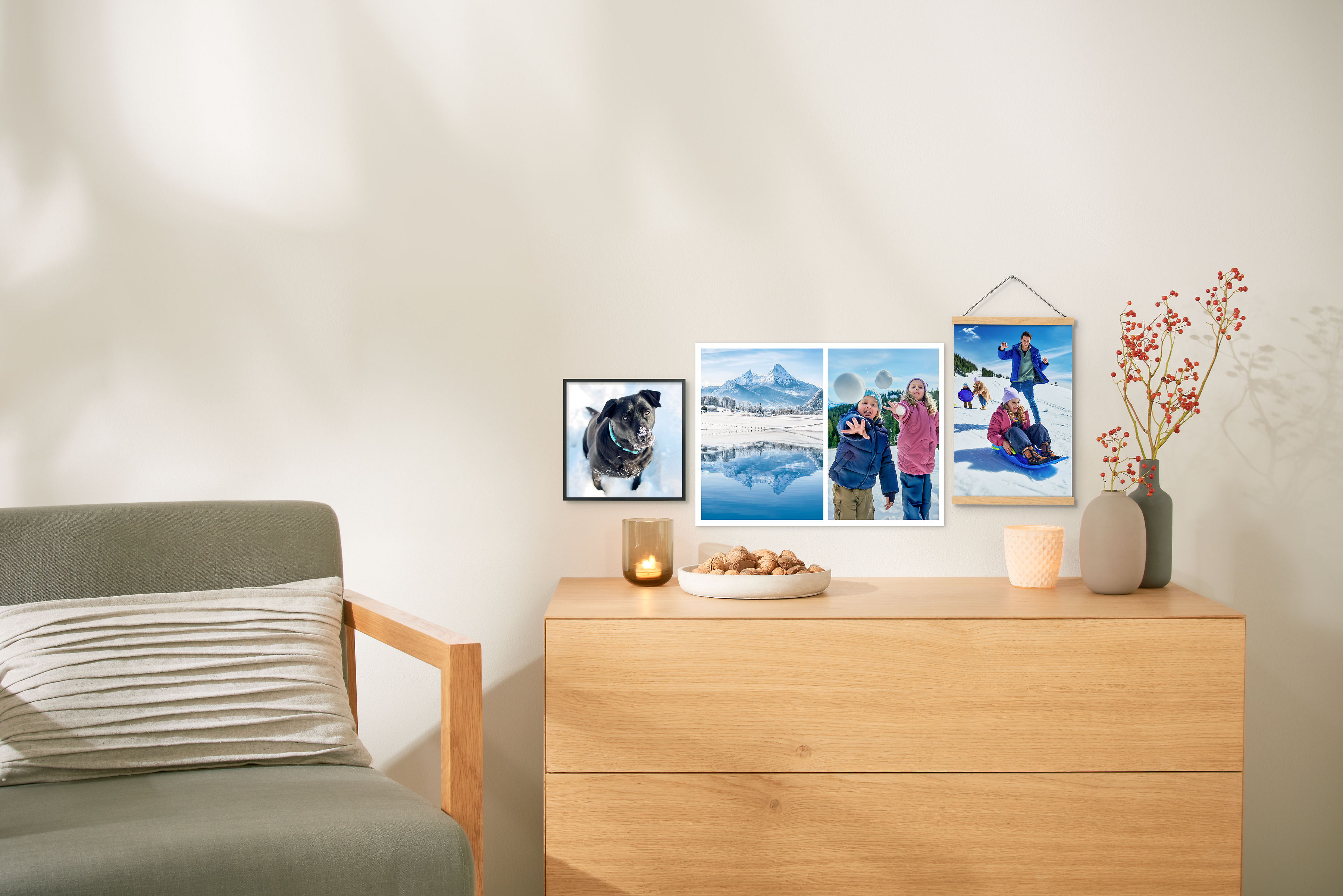 Drei Fotoposter hängen an einer Wand. Alle sind mit unterschiedlichen Winterfotos gestaltet. 