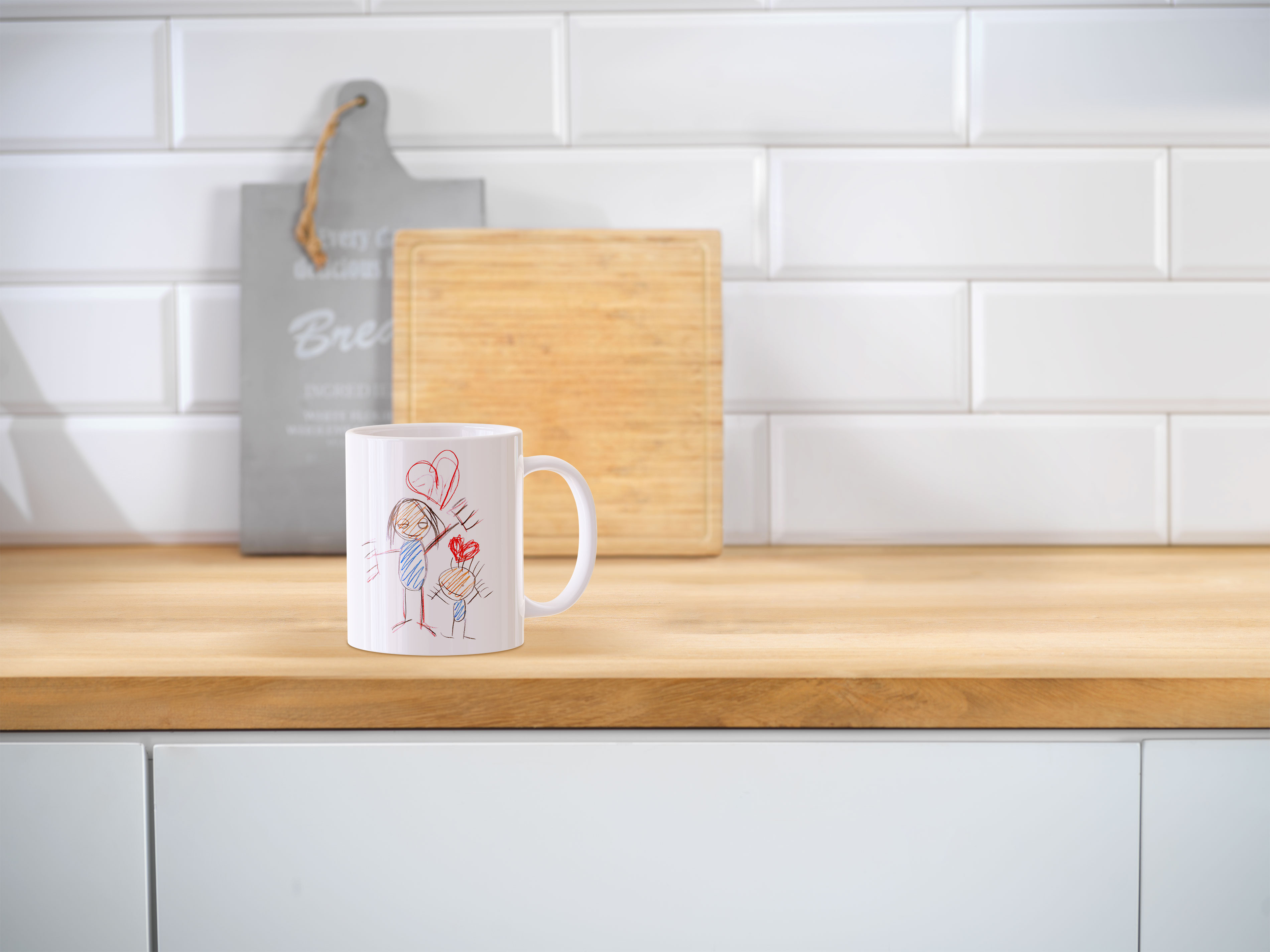 Een fotomok met een tekening erop als fotocadeau voor de juf of meester.