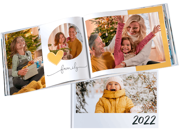 Pixum Fotoboek maken Opengeslagen Pixum Fotoboek met familiefoto's in Kerstsfeer