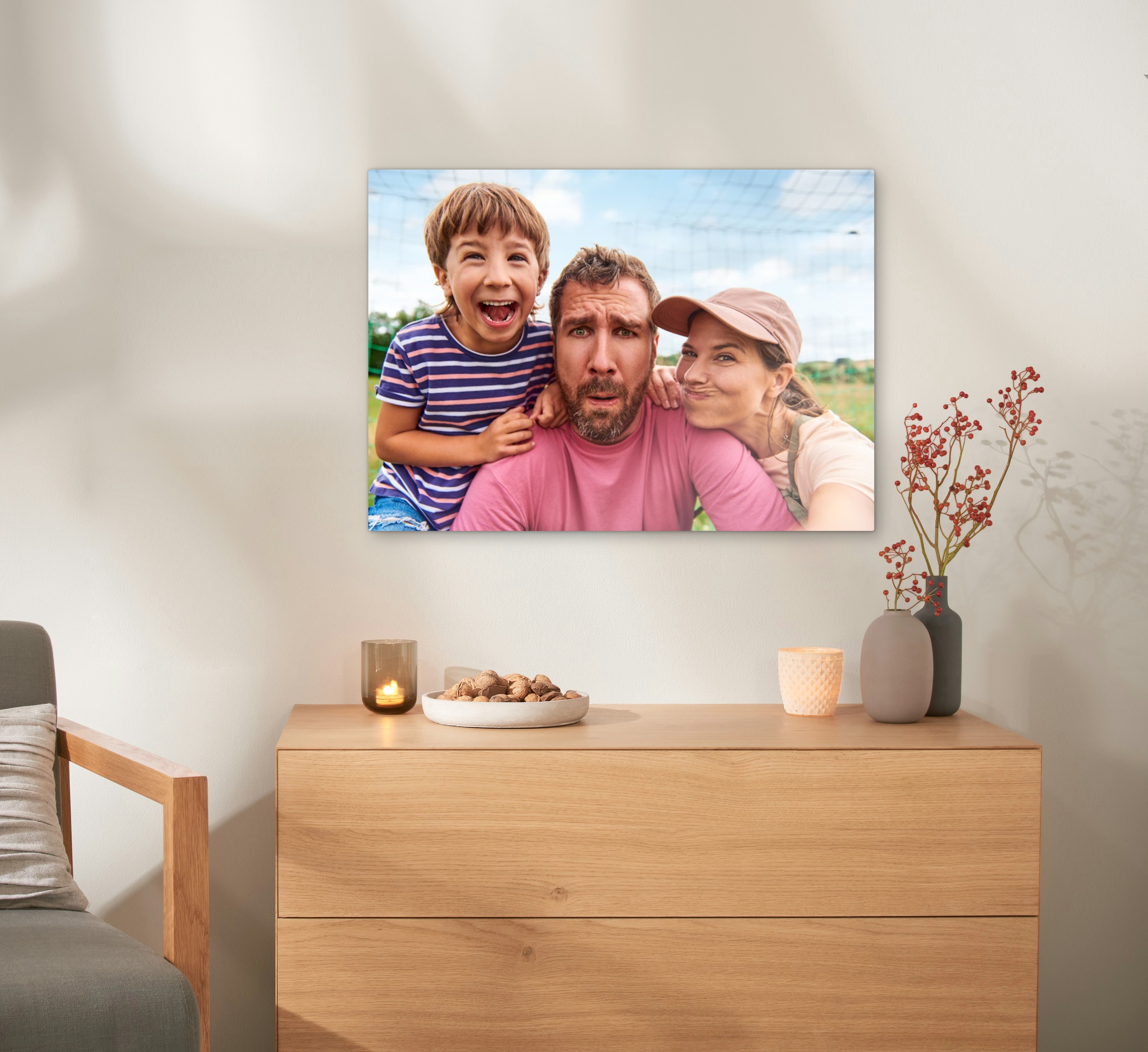 Canvas met foto van een familie: zoon, vader en moeder.