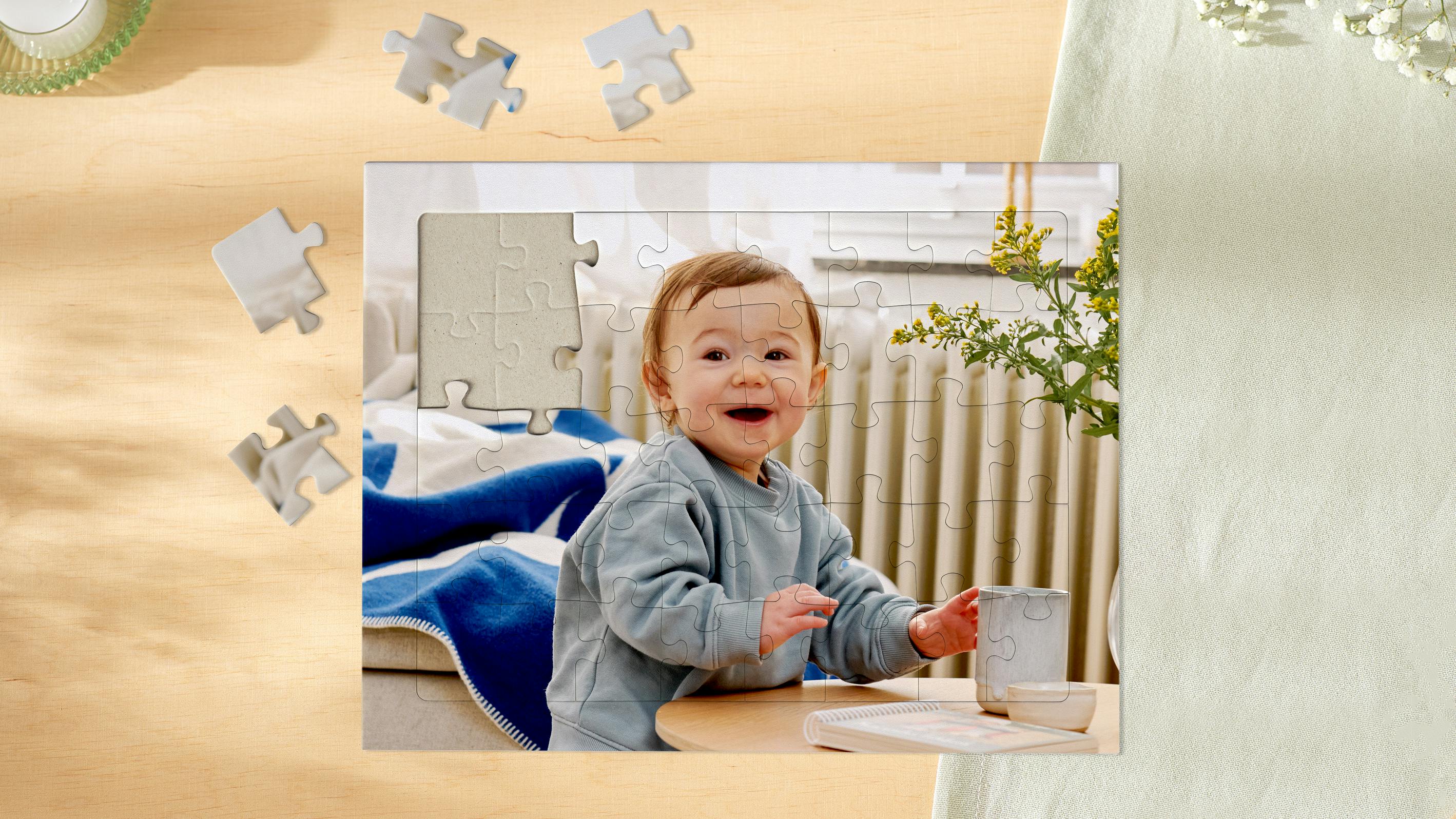 Children's puzzle with photo of a baby