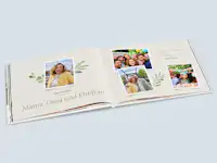 Geburtstagsfotobuch für Mama Aufgeschlagenes Geburtstagsfotobuch, das von der Familie für die Mama bzw. Oma gestaltet wurde.