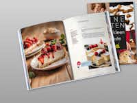 Backbuchvorlage: Meine besten Rezepte für Gäste Aufgeschlagenes Backbuch, das mit einer Vorlage von Pixum selbst gestaltet wurde.