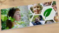 Pixum Photo Book Opened Pixum photo book in sustainable design on a wooden table
