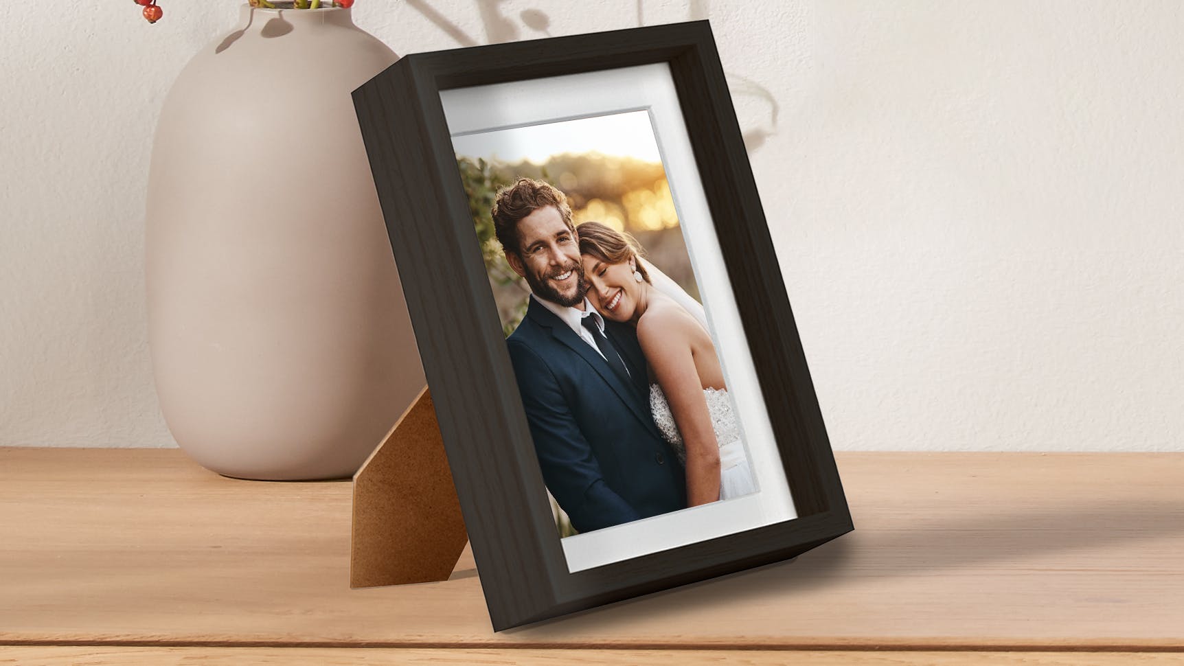 Foto i ramme med et bryllupsfoto