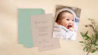 Pixum photo greeting cards for birth in a set of 10 Photo birth cards with baby photo and text on a table