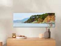 Lienzo fotográfico de Pixum con un motivo paisajístico Un lienzo con una foto de una playa cuelga de la pared