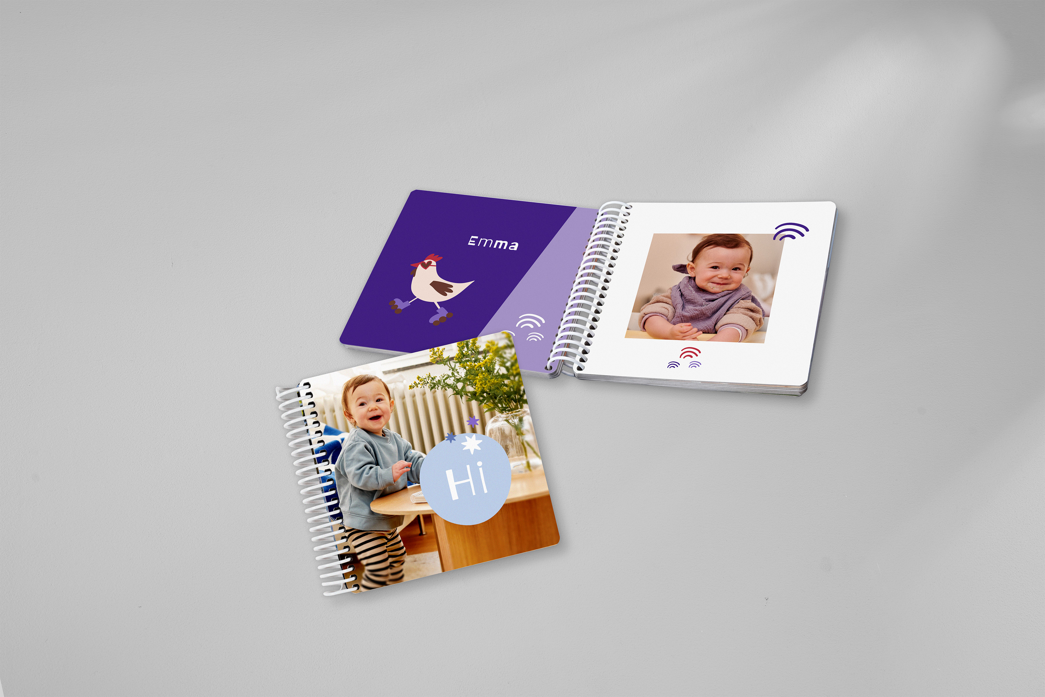 Pixum Fotobuch Baby mit einem bunten Tierwelt-Design und Fotos eines Kleinkindes