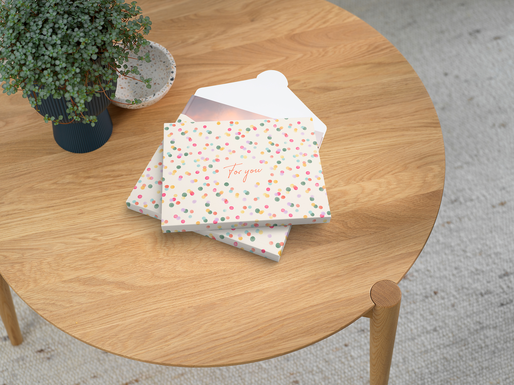 Livre photo Pixum dans une boîte emballage cadeau à pois colorés