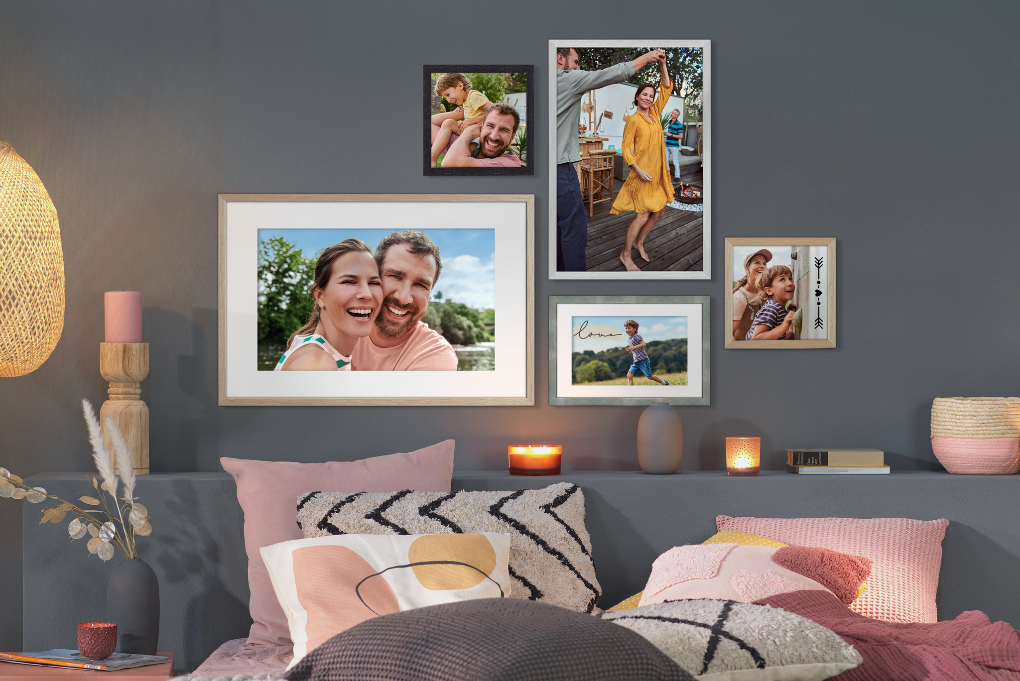 A selection of wooden frames in different colours with family and landscape images 