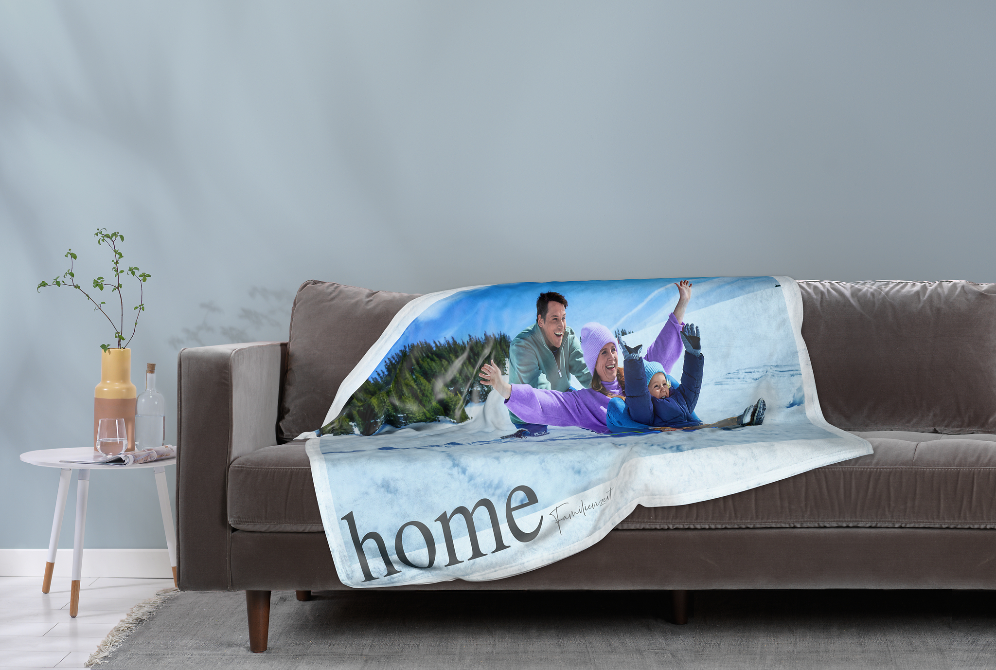 Photo blanket with a photo of a family in the snow.