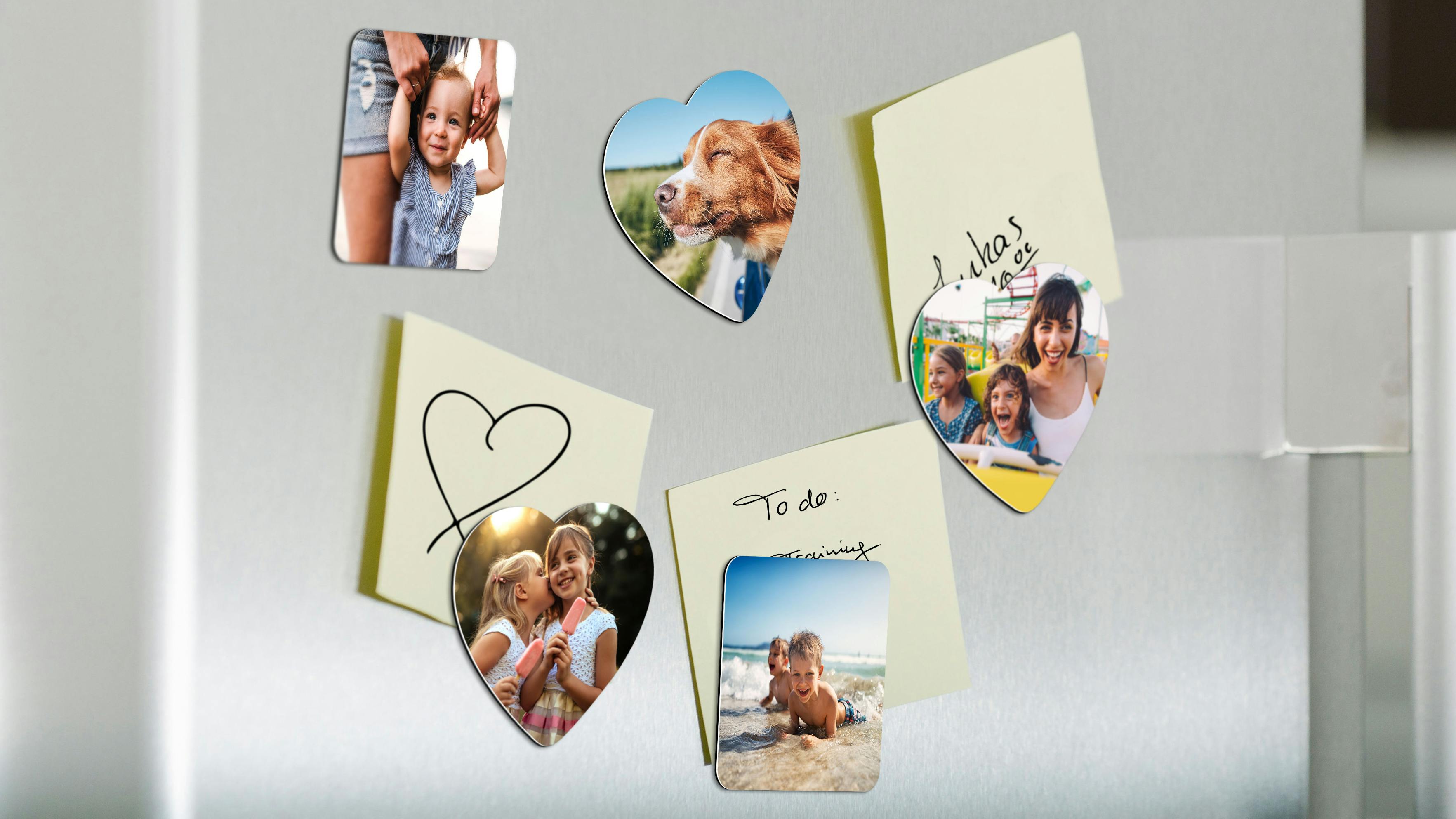 Mix of heart-shaped and square photo magnets on a fridge