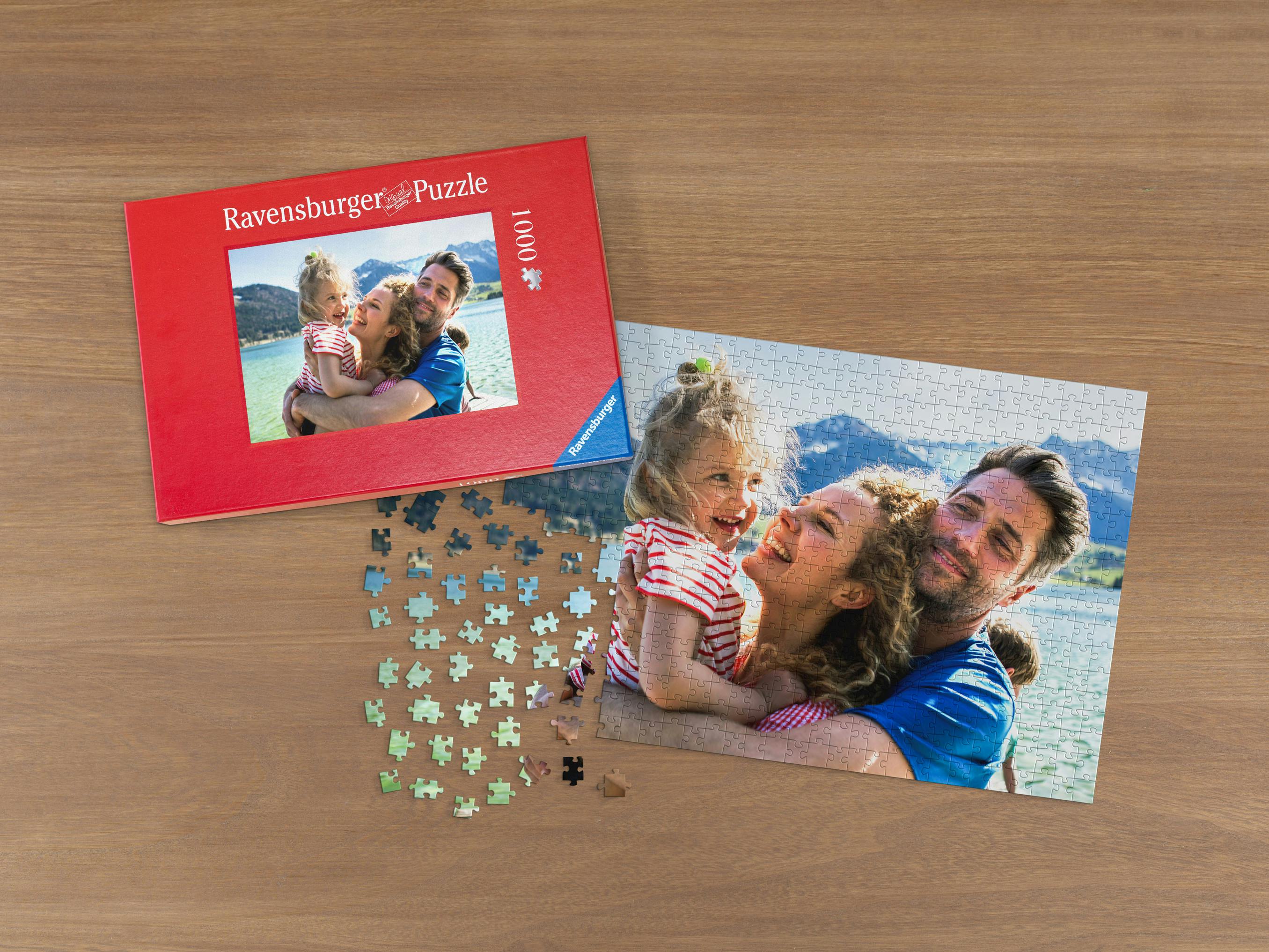 Ravensburger Photo puzzle with 1,000 pieces on a table with a holiday photo of a family by a lake near the mountains